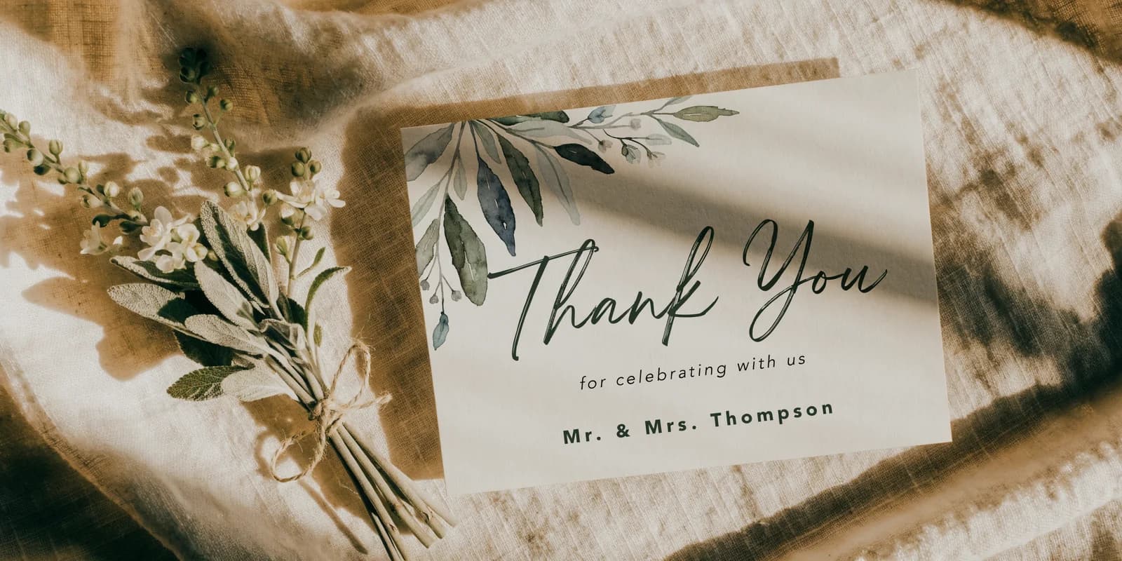 Personalized thank-you card with botanical watercolor and lettered name on cream card stock